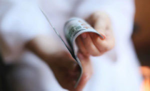 person browsing retirement plan brochure